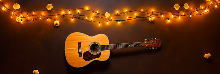 Illuminated guitar on black background