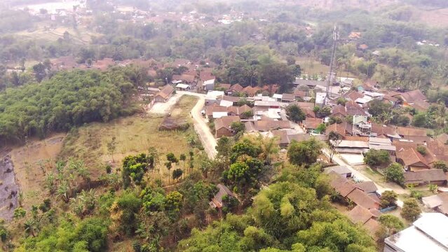 Drone Videography. Aerial shot. Aerial Footage Village at the foot of the mountain in the Cikancung area - Bandung, Indonesia. Shot in 4k resolution from a flying drone. Asia