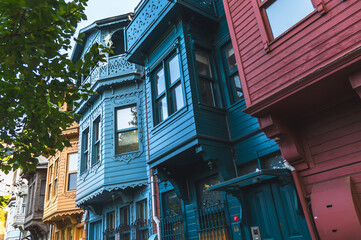 Fototapeta na wymiar Wooden colored houses in the Usküdar-Kuzguncuk area of Istanbul.