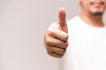 Man's thumbs up isolated on white background.Like sign finger and hand.Good idea concept.