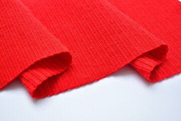 wavy of red wool knitted yarn texture, woolen fabric on white background