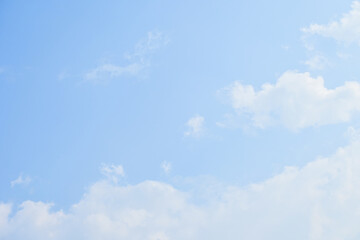 beautiful blue sky and white fluffy cloud with sunrise in the morning, natural background