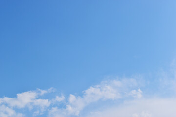 beautiful blue sky and white fluffy group of clouds with sunrise in the morning, natural background