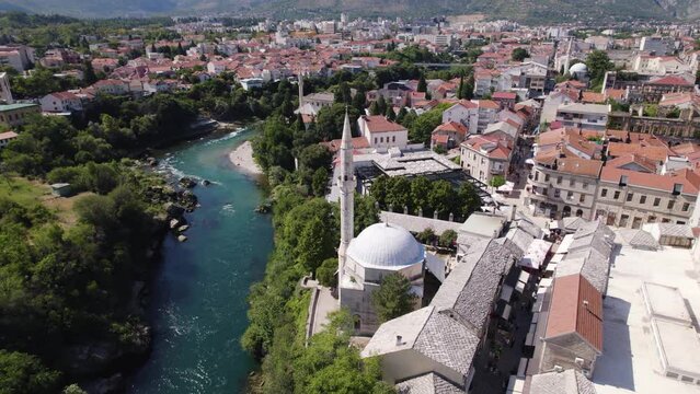 Aerial circling Koski Mehmed Pasha Mosque Ottoman architecture in Mostar city Bosnia and Herzegovina
