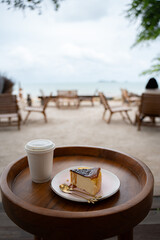 Coffee and dessert on the background of the sea.