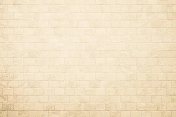 Fotobehang Empty background of wide cream brick wall texture. Beige old brown brick wall concrete or stone textured, wallpaper limestone abstract flooring. Grid uneven interior rock. Home decor design backdrop. © siripak