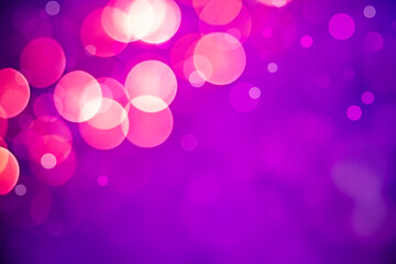 pink bokeh on purple background with copy space