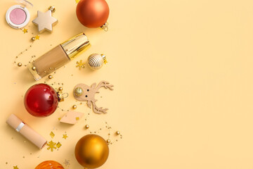 Composition with decorative cosmetics and Christmas decor on beige background