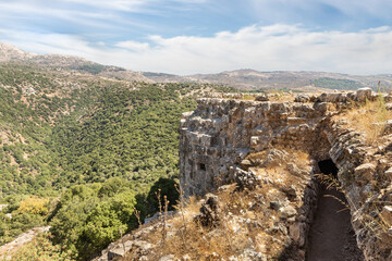 Fototapeta premium View of the adjacent gorge from the round watchtower in the medieval fortress of Nimrod - Qalaat al-Subeiba, located near the border with Syria and Lebanon in the Golan Heights, in northern Israel
