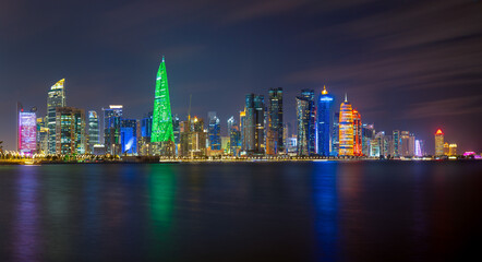 Fototapeta premium Panoramic skyline of Doha city after sunset, Qatar