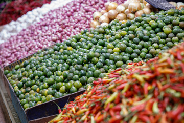 Variety of fresh vegetables, fruits, spices and many other commodities on the Indonesian outdoor fresh market in the Southeast Asia