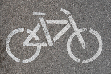 Bike path, bicycle sign on asphalt. White