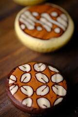 Bakpia Kukus Batik, is a modern bakpia containing melted cheese or chocolate cooked by steaming. The top of the bakpia is painted with traditional batik motifs. Indonesian food.