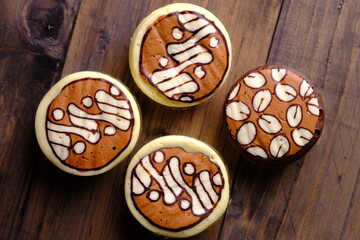 Bakpia Kukus Batik, is a modern bakpia containing melted cheese or chocolate cooked by steaming. The top of the bakpia is painted with traditional batik motifs. Indonesian food.