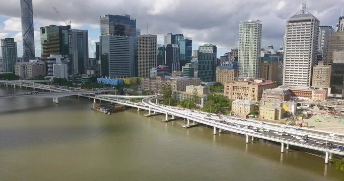 Aerial flying backwards from Brisbane River, CBD in background, Brisbane, Australia