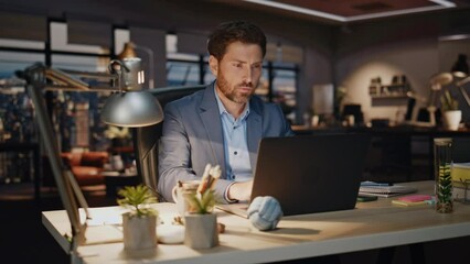 Business man drinking coffee late evening workplace closeup. Workaholic typing