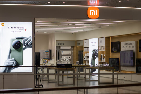 Shanghai, China - June 28, 2023: Front view of a Xiaomi store in Shanghai. Advertisement for Xiaomi 13 Ultra smartphone featuring a quad camera system powered by Leica is seen at the storefront.