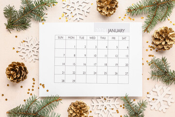 Paper calendar for January with Christmas decorations on white background