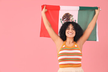 Beautiful woman with Mexican flag on pink background
