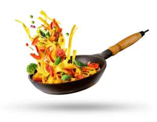 Foto op Plexiglas Cooking Italian pasta with vegetables flying over a hot frying pan isolated in white. © Soho A studio