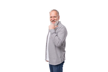 Fototapeta premium handsome gray-haired elderly man with a beard in a checkered shirt on a white background with copy space