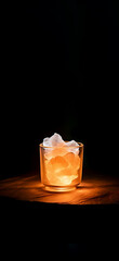 Orange salt mineral crystal in a glass