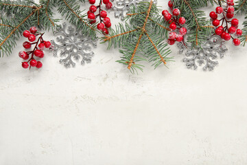 Fototapeta na wymiar Beautiful snowflakes with fir branches and berries on grunge white background