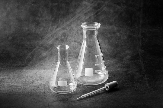 science experiment bottle on black background