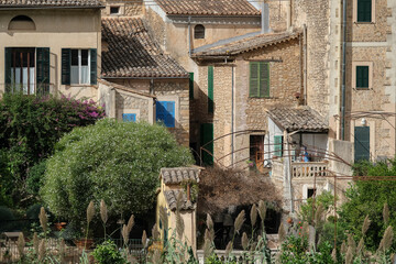 Medieval historic old house facades architecture in small alleys, streets and backstreets of Soller...