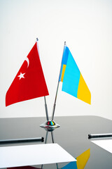 Turkey and Ukraine flags on table close up