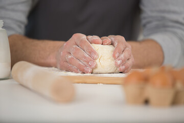 cropped view of hands around pastry