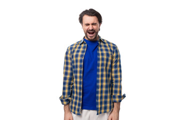 a young Caucasian brutal man with an unshaven face dressed in a blue plaid shirt emotionally...