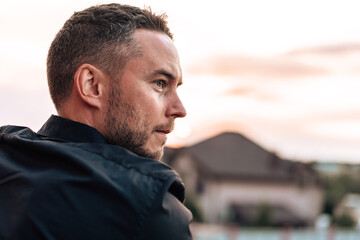 Fototapeta premium Portrait of handsome successful man standing outdoors