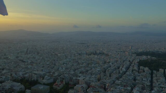 Aerial dusk view of sprawling Athens landscape.