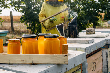 Closeup view of jars of honey in a crate