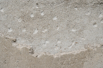 The background of an old wall decorated with gray cement mortar