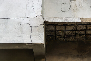 Old concrete wall with white and cracked peeling texture. Grunge cracked concrete wall.