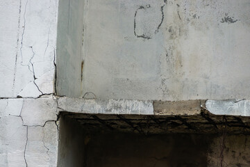 Old concrete wall with white and cracked peeling texture. Grunge cracked concrete wall.