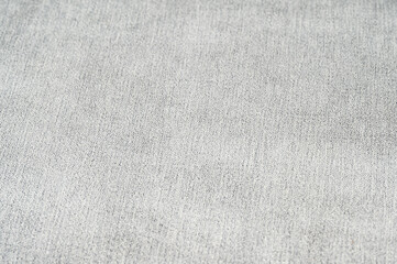 Fototapeta na wymiar Uniform background of gray fabric with a pattern