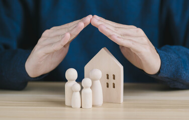 hand protect family and home. concept of life and home insurance assurance for customer and...