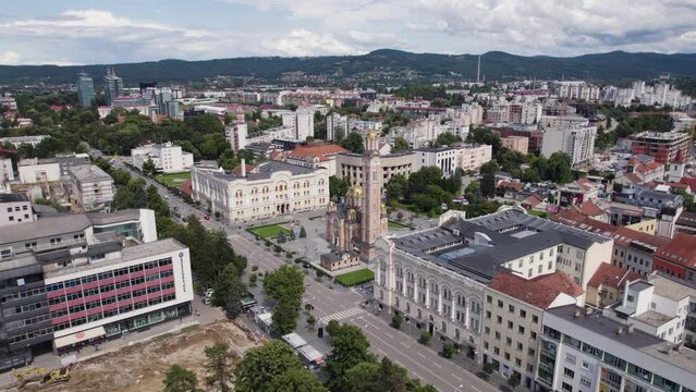 Aerial view circling Christ the Saviour Orthodox Cathedral and dense occupied Baja Luka cityscape
