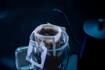Drip coffee and pour water on the black stone table, soft focus.shallow focus effect.