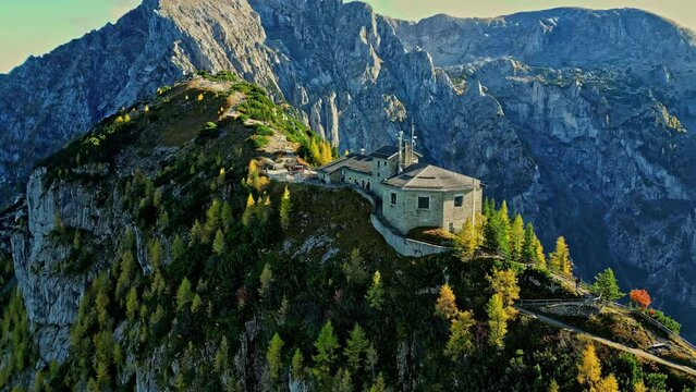 Kehlsteinhaus on top of rocky Alp mountains, aerial orbit view