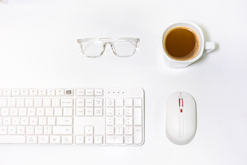 cup of coffee and keyboard with mouse and glasses, writers bussiness copywriter accessories