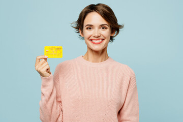 Young smiling happy woman she wear beige knitted sweater casual clothes hold in hand mock up of...