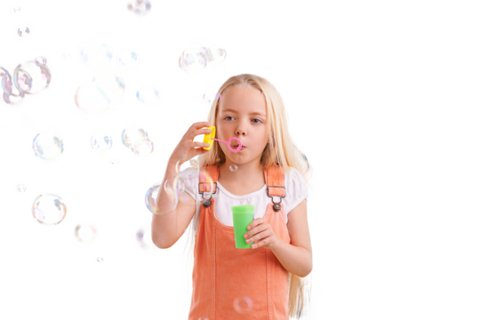 Bubble, fun and young girl with casual clothing and fashion with play and kid blowing liquid. Child, style and female youth isolated on a transparent, png background happy from playful and kids toy - Powered by Adobe