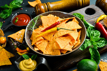 Bowl nachos chips with spices and chili pepper. Tortilla chips. Corn chips. Top view.