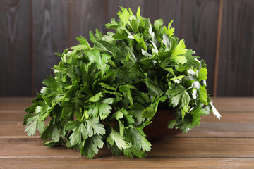 Bunch of fresh parsley on wooden table