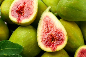 Cut and whole green figs as background, above view