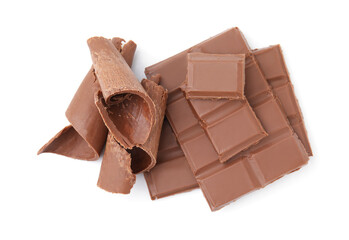 Pieces of tasty chocolate bar and shavings isolated on white, top view